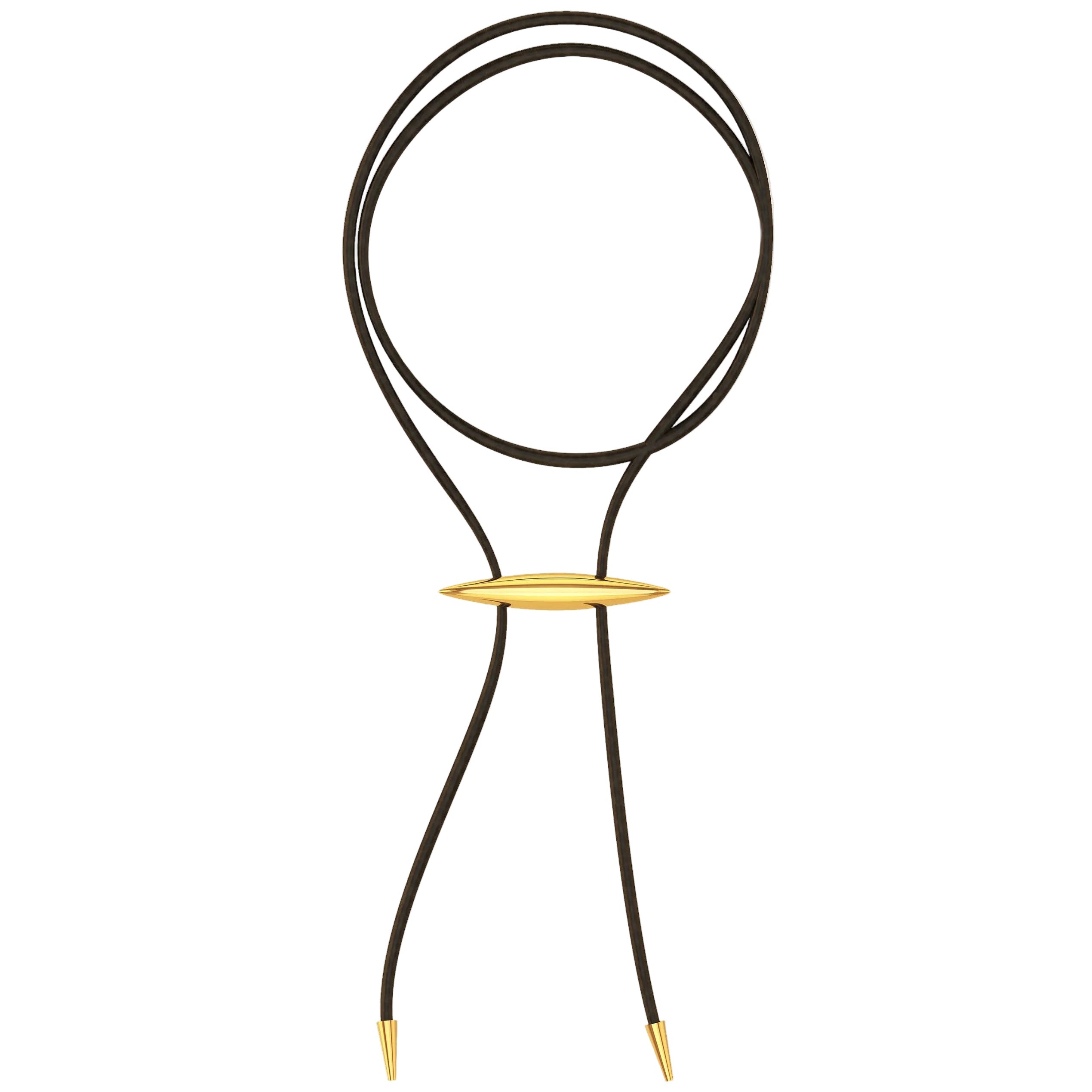 Black cord necklace with a gold accent on a white background