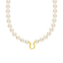Pearl necklace with a gold clasp on a white background