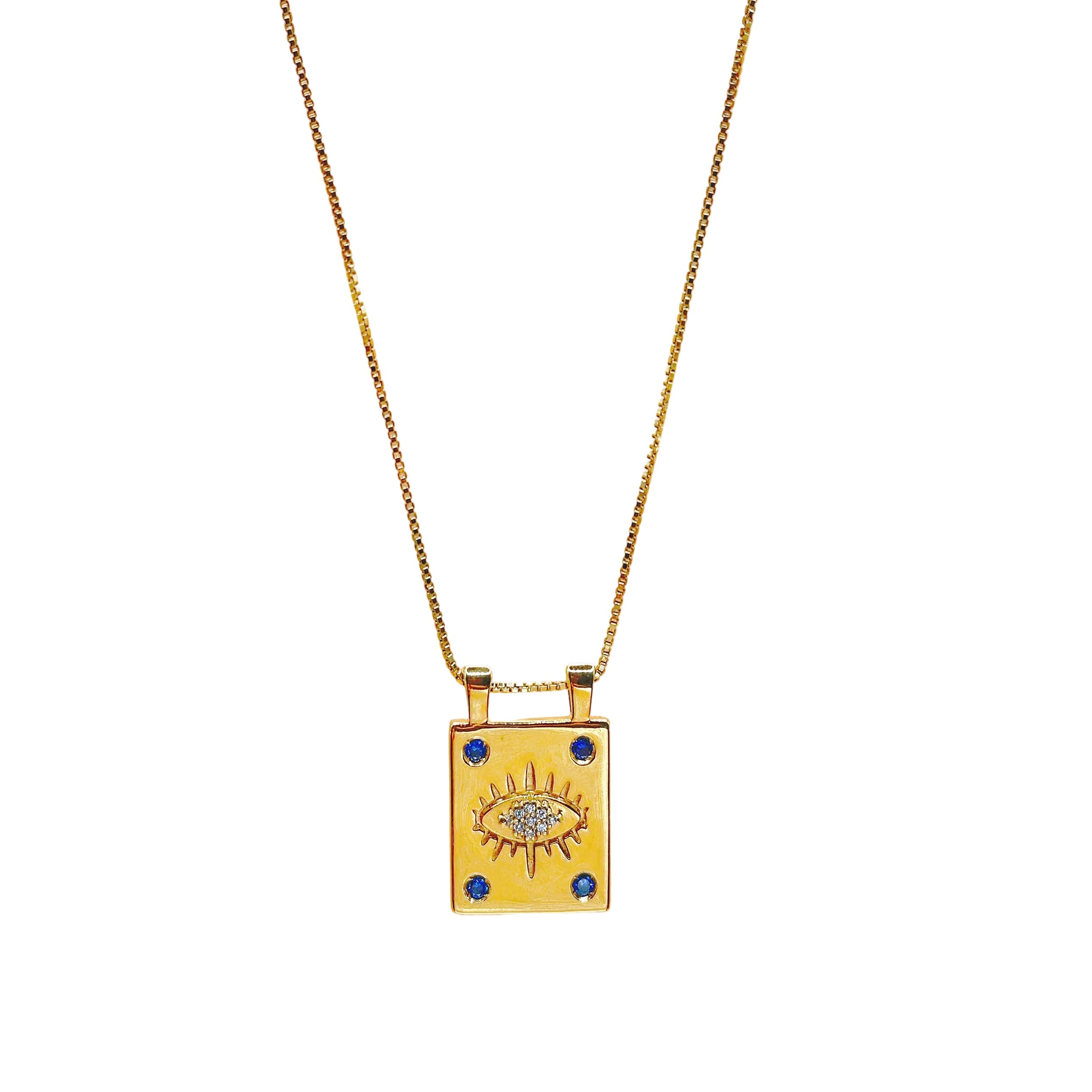 Gold necklace with a square pendant featuring an eye design on a white background