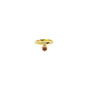Gold ring with a small gemstone on a white background