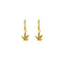 Gold cannabis leaf earrings on a white background