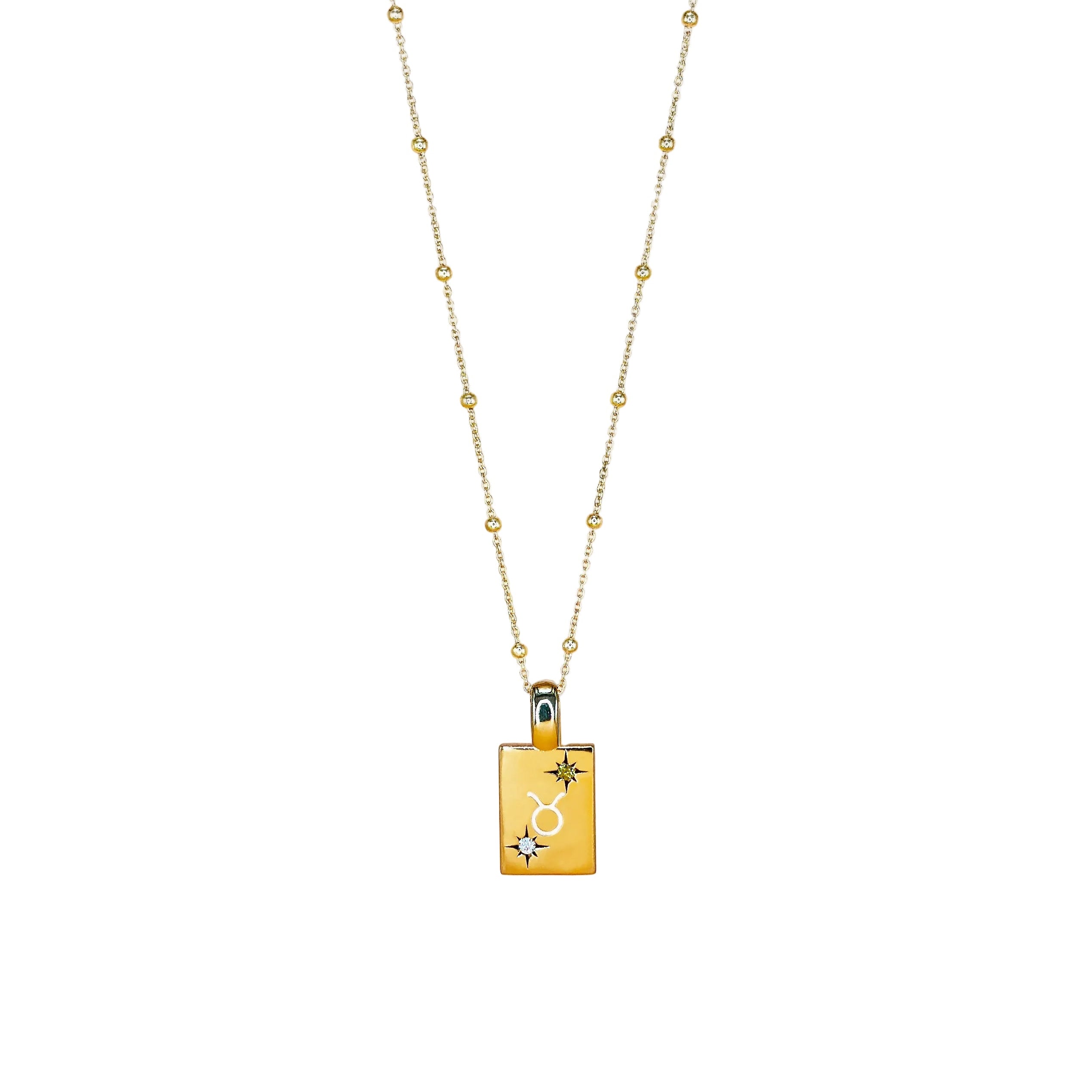 Gold necklace with a rectangular pendant on a white background