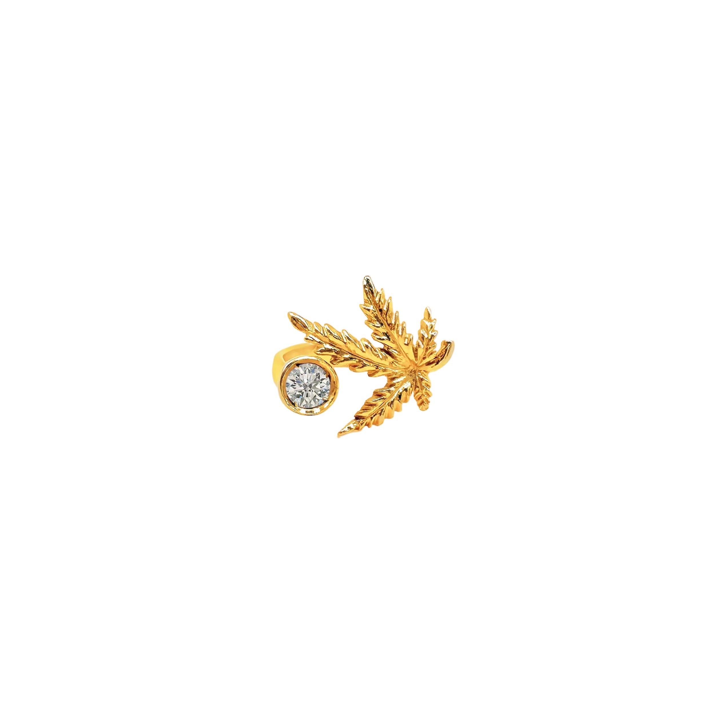 Gold earring with a diamond on a white background