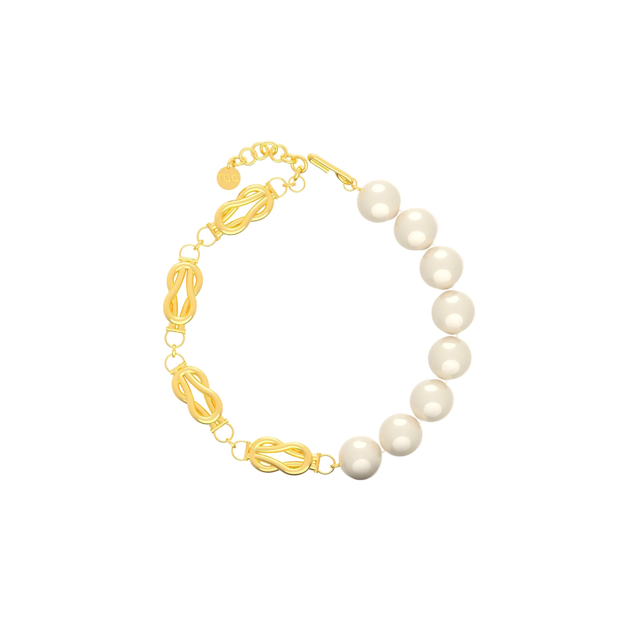 Pearl bracelet with gold links on a white background
