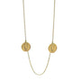 Gold necklace with two round pendants on a white background