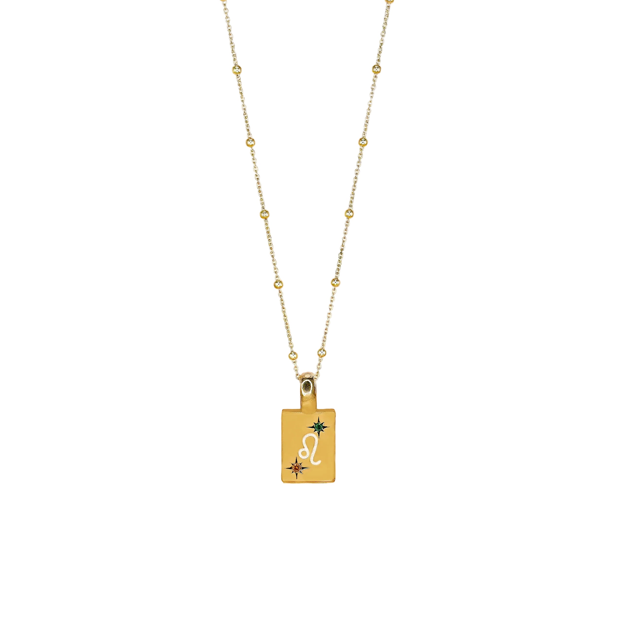 A gold-colored necklace featuring a Leo symbol pendant with dark orange and luminous green zirconia stones.
