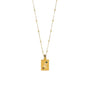 A gold-colored necklace featuring a Leo symbol pendant with dark orange and luminous green zirconia stones.